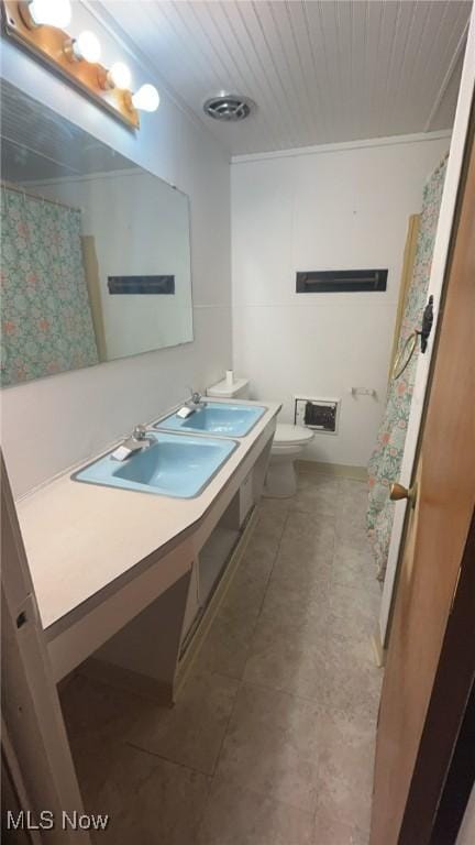 full bathroom with toilet, wood ceiling, visible vents, and vanity