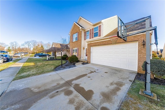 view of front of property featuring a garage and a front yard