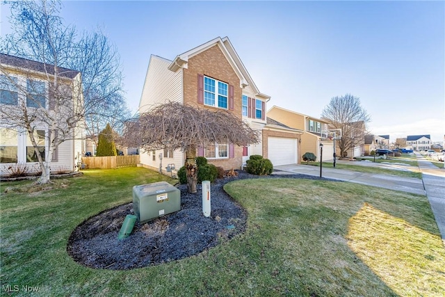 view of front of home featuring a garage and a front lawn