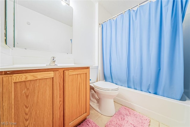 full bathroom featuring tile patterned flooring, vanity, toilet, and shower / bath combo with shower curtain