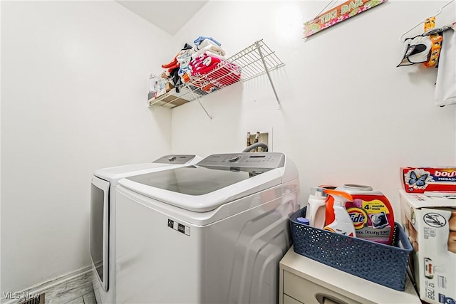 laundry room featuring independent washer and dryer