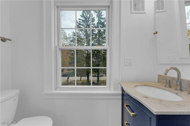 bathroom with vanity and toilet