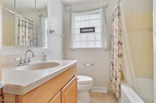 full bathroom featuring shower / bath combination with curtain, tile patterned floors, vanity, and toilet