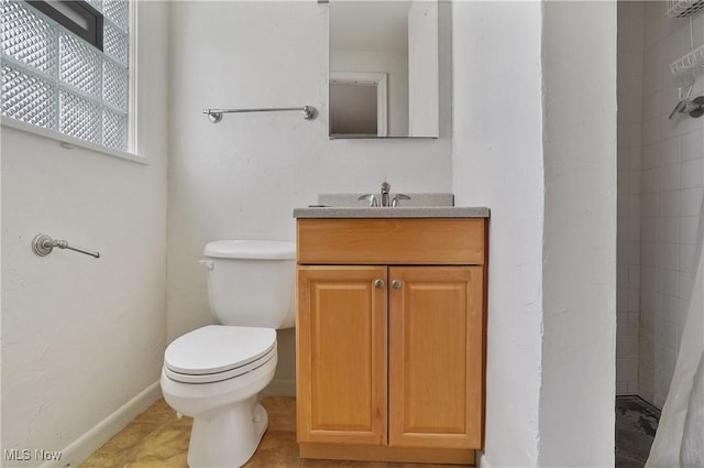 bathroom with vanity, a shower with curtain, tile patterned floors, and toilet