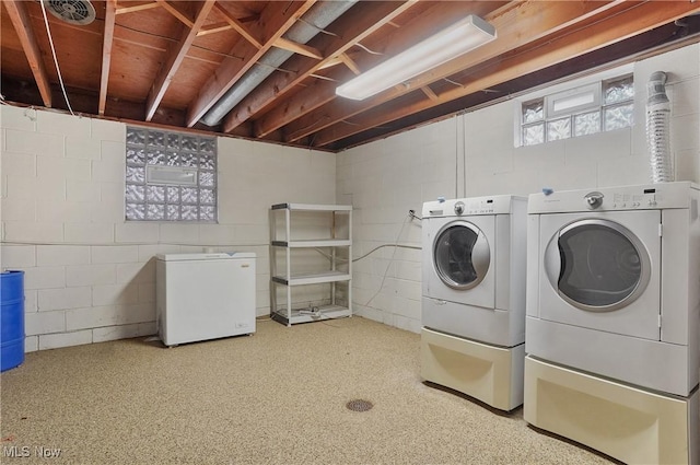 clothes washing area featuring washing machine and clothes dryer