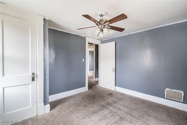 unfurnished bedroom with ceiling fan and carpet flooring