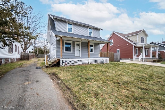 view of front of home featuring a front lawn and a porch