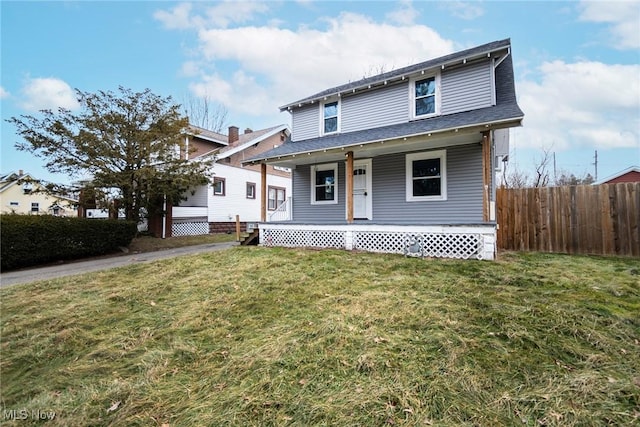 front of property with a porch and a front lawn