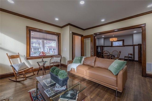 living room featuring ornamental molding and dark hardwood / wood-style floors