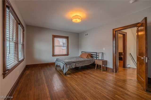 bedroom featuring wood-type flooring