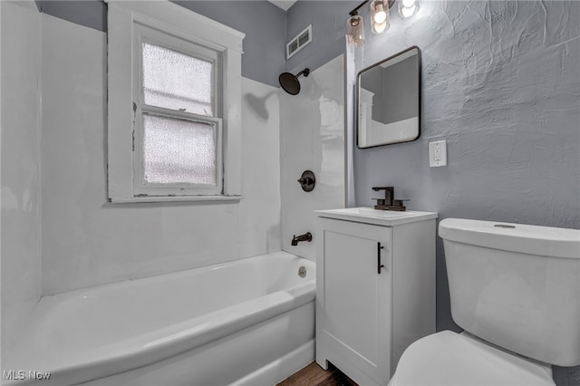 full bathroom featuring shower / bathtub combination, vanity, and toilet