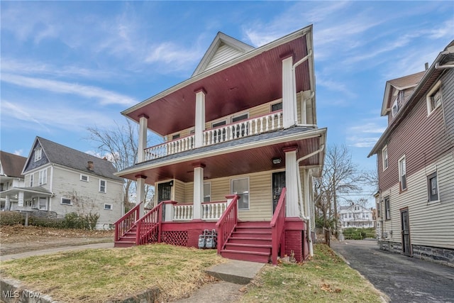 view of front facade with covered porch and a front yard