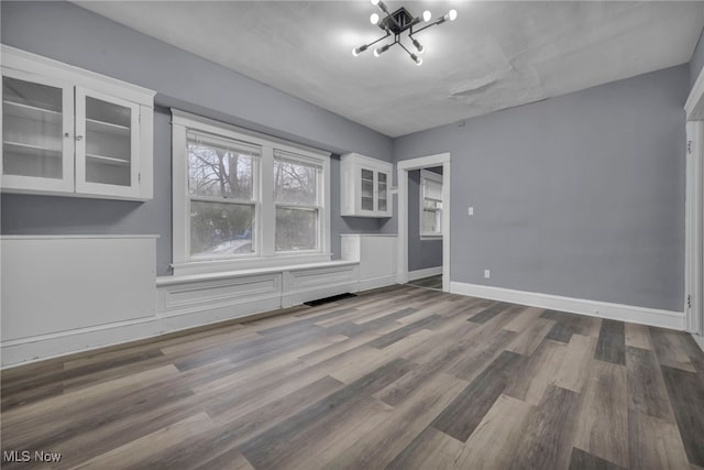 empty room featuring wood-type flooring