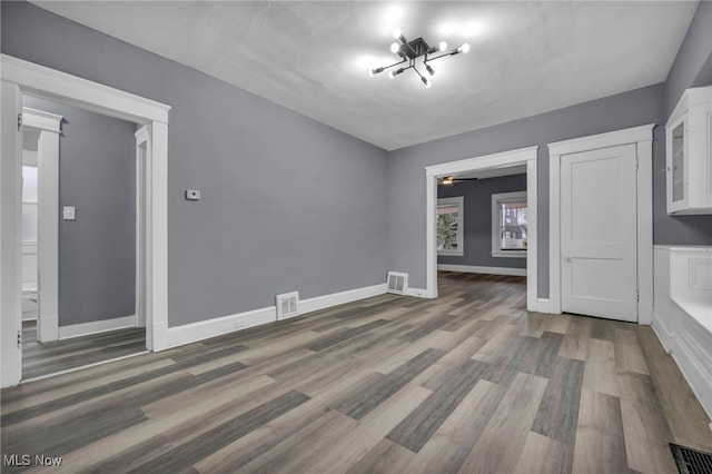 unfurnished living room with hardwood / wood-style floors