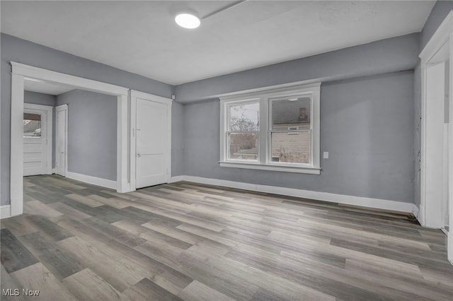 unfurnished bedroom featuring hardwood / wood-style floors