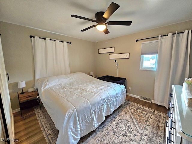 bedroom featuring ceiling fan and dark hardwood / wood-style flooring