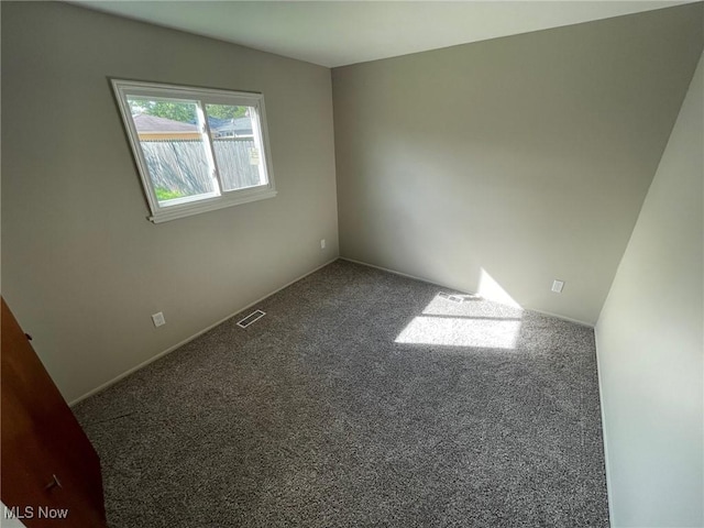 unfurnished room featuring carpet flooring