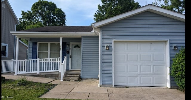 ranch-style home with a garage and covered porch