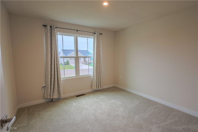 unfurnished room featuring carpet flooring