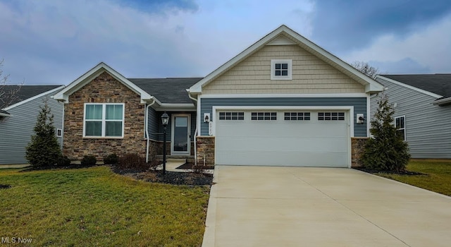 craftsman-style home with a garage and a front lawn