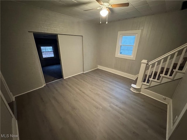 unfurnished bedroom featuring hardwood / wood-style flooring and ceiling fan