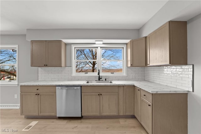 kitchen featuring sink, dishwasher, light hardwood / wood-style floors, light brown cabinetry, and decorative backsplash