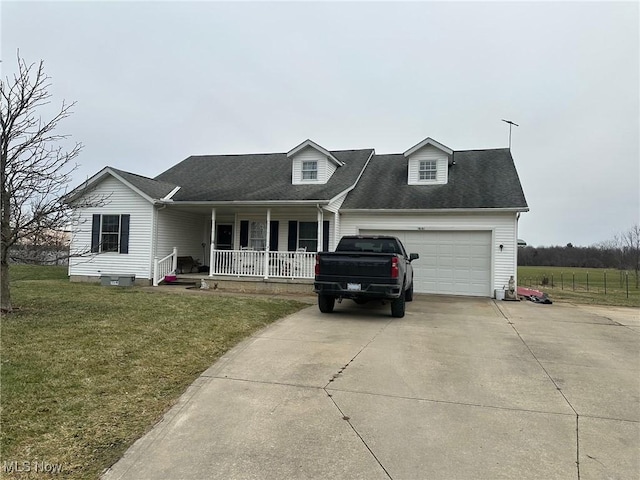 cape cod home with a porch, a garage, and a front lawn