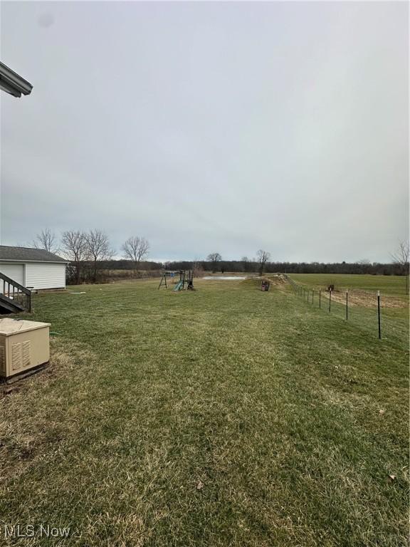 view of yard with a rural view