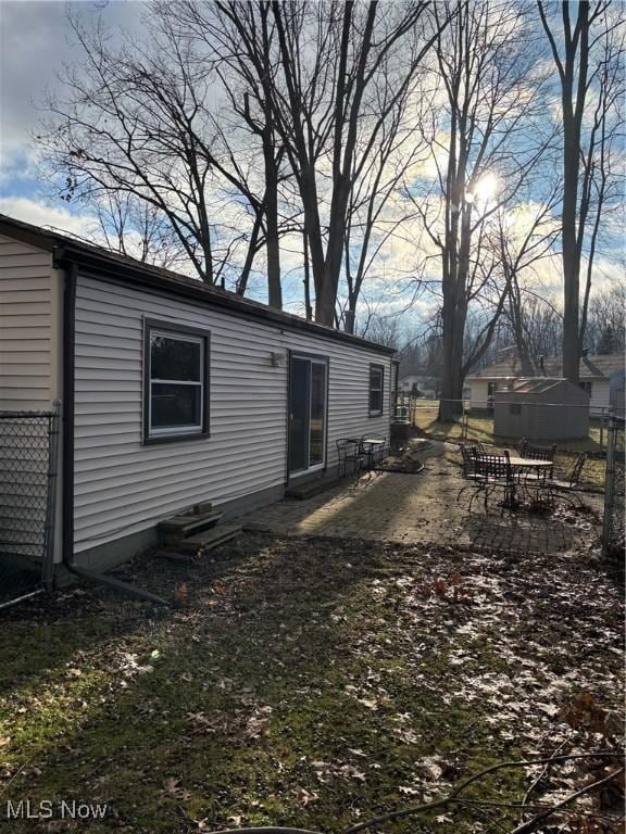 rear view of house featuring a patio