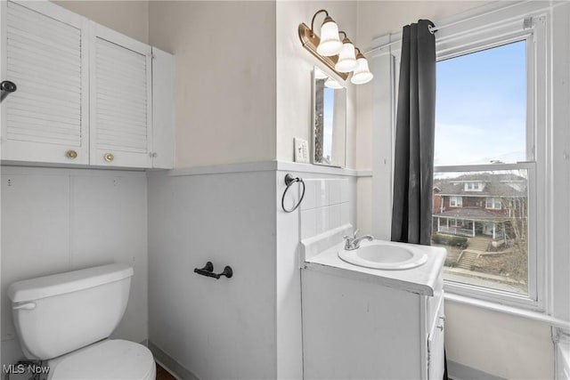 bathroom with vanity and toilet