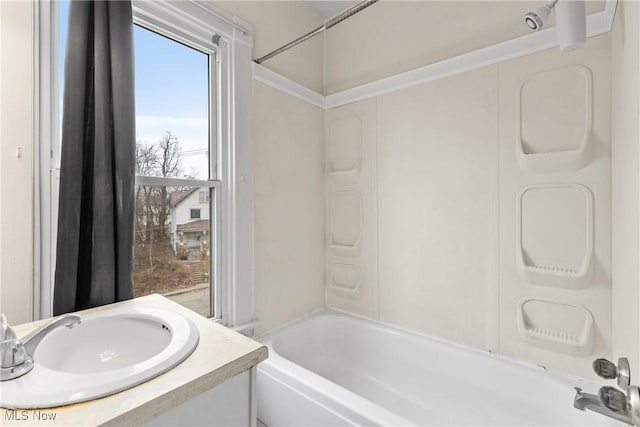 bathroom with sink and washtub / shower combination