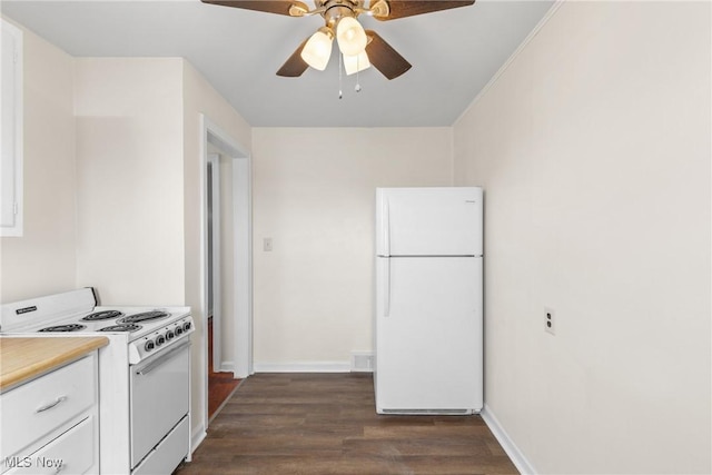 kitchen with ceiling fan, white appliances, dark hardwood / wood-style flooring, and white cabinets