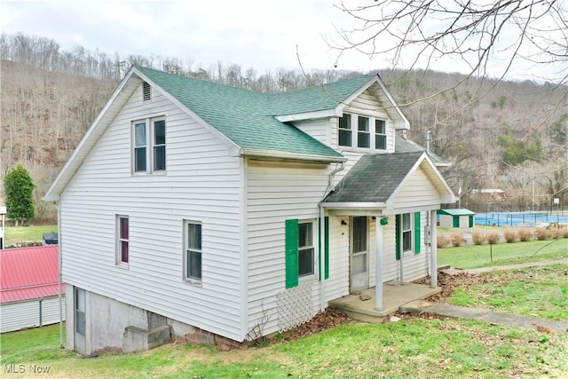 back of house with a yard