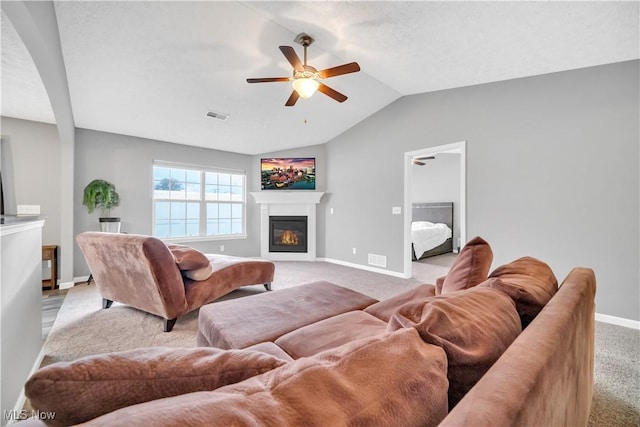 living room with vaulted ceiling, light carpet, and ceiling fan