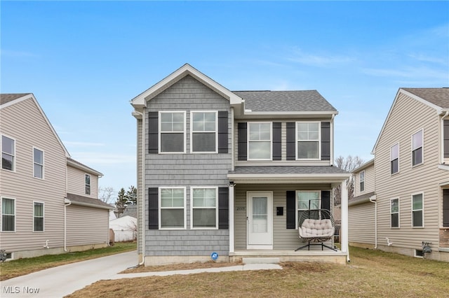 view of front of house featuring covered porch and a front yard