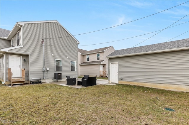 back of property featuring a patio, outdoor lounge area, a yard, and central AC unit