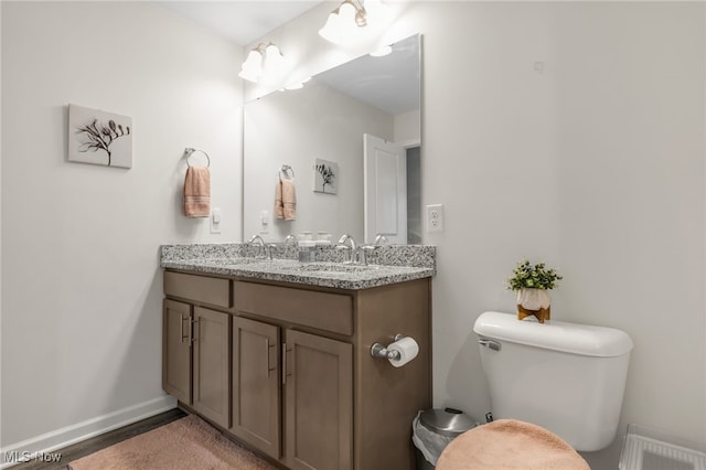 bathroom with vanity and toilet