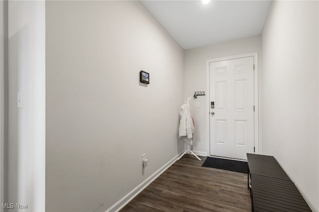 doorway with dark wood-type flooring