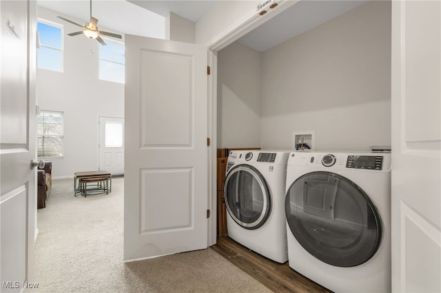 laundry area featuring ceiling fan, a healthy amount of sunlight, separate washer and dryer, and dark carpet