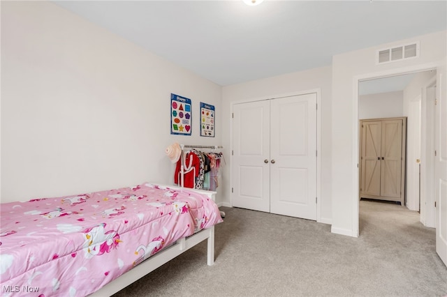 carpeted bedroom with a closet