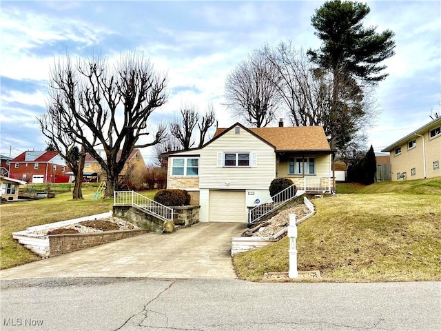 view of front of home with a garage and a front lawn