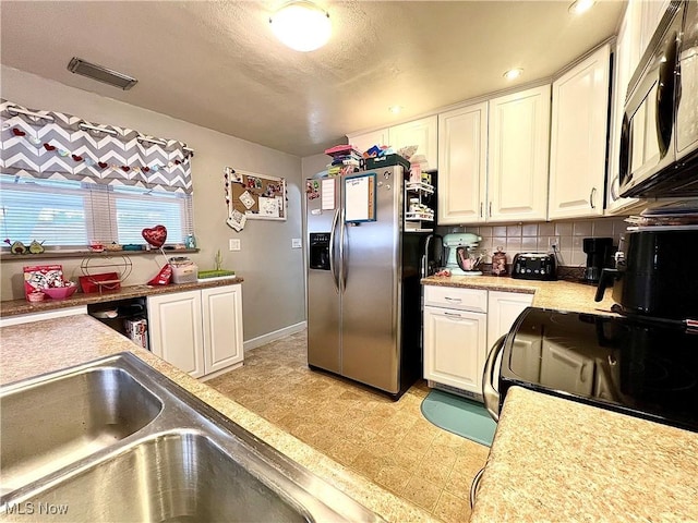 kitchen featuring white cabinetry, decorative backsplash, electric range, and stainless steel refrigerator with ice dispenser