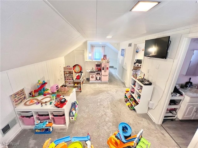 game room featuring vaulted ceiling and carpet flooring