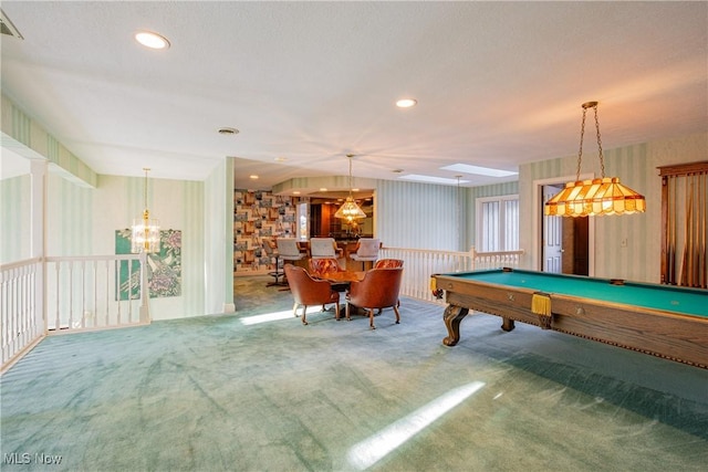 recreation room with an inviting chandelier and carpet