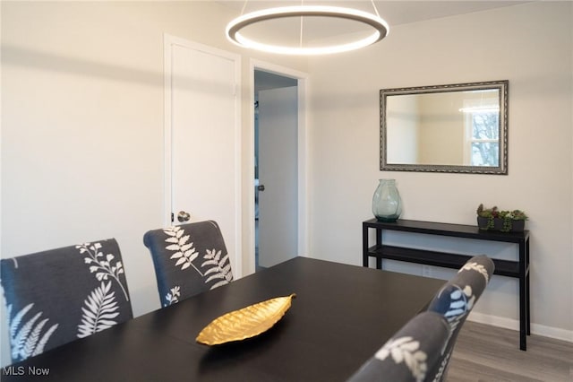 dining area with wood-type flooring