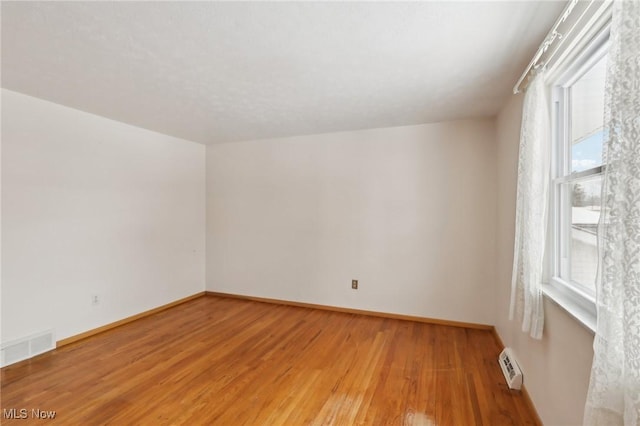 empty room featuring wood-type flooring