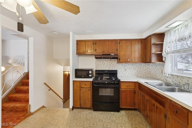 kitchen featuring tasteful backsplash, sink, black appliances, and ceiling fan