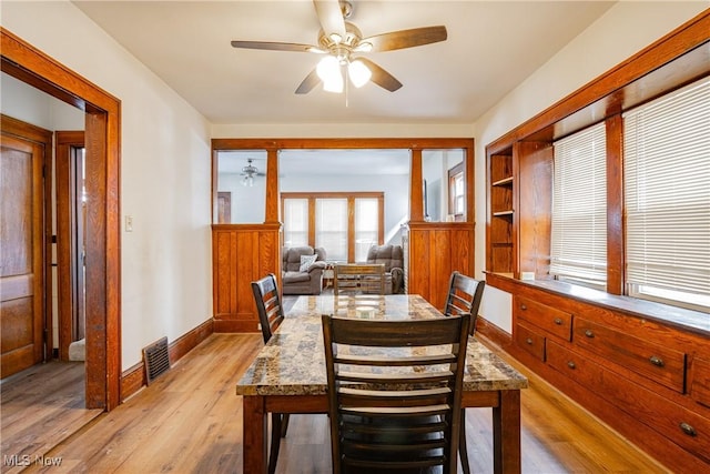 dining area featuring light hardwood / wood-style flooring and ceiling fan