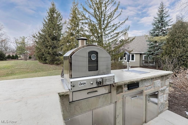 view of patio / terrace featuring an outdoor kitchen