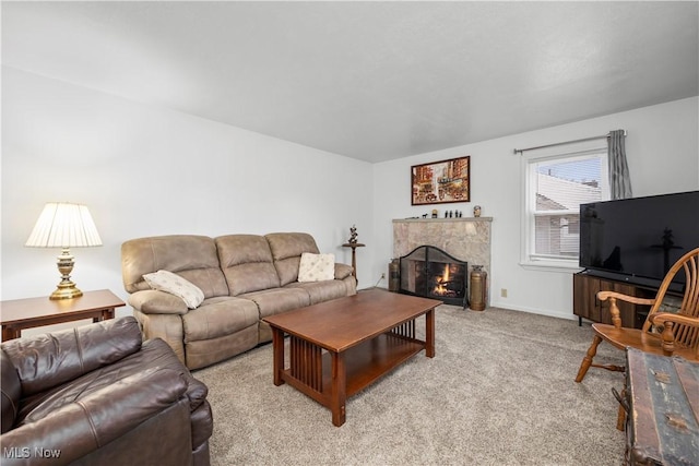 living room with light colored carpet and a fireplace